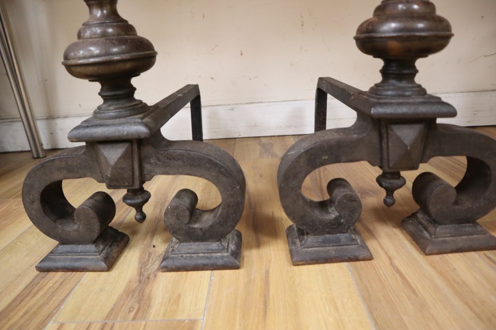 A pair of 17th century style iron andirons, height 64cm